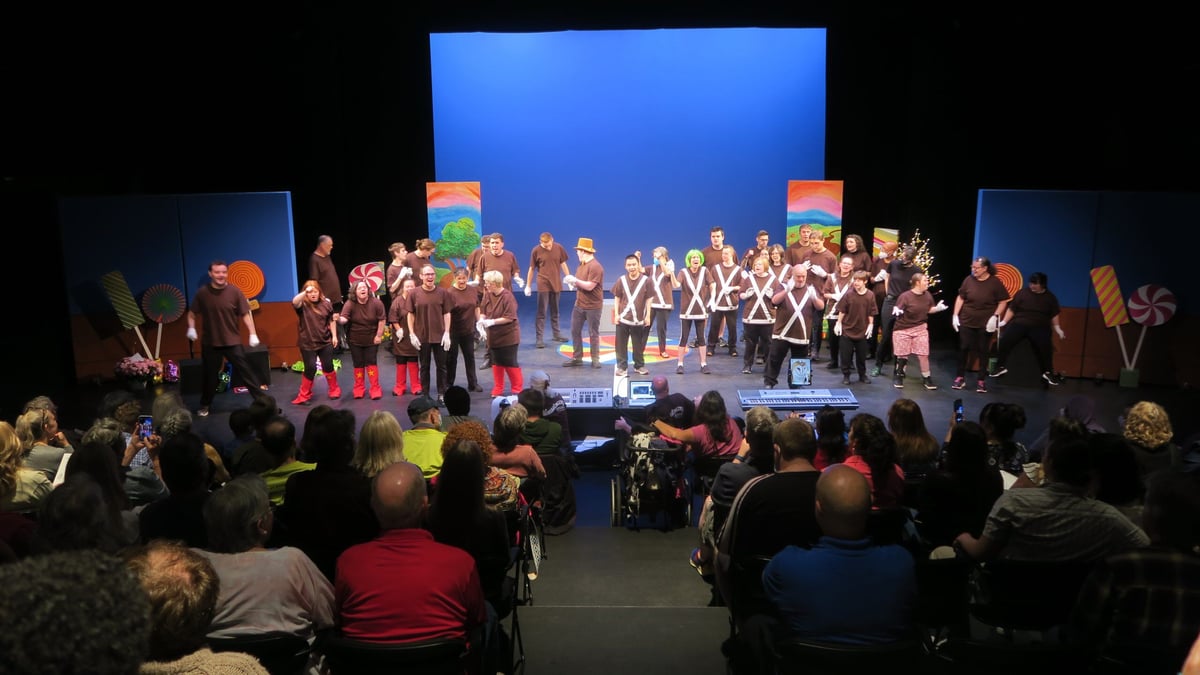 Whole Children and Milestone’s Theater Production is on stage performing their original play “Wonkavengers” in front of a live audience.